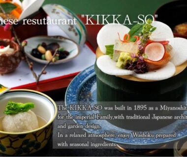Assorted small dishes and bowls on lacquer trays at ryokan restaurant table