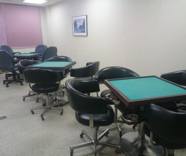 Game room with green-topped game tables and swivel chairs at The Gran Resort Arima, Hyōgo