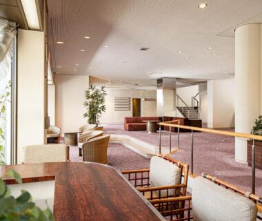 Ryokan lobby seating area with low tables and woven chairs at The Gran Resort Elegante Atami Shizuoka