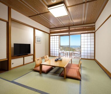 Tatami room with low table, shoji screens and balcony view at The Gran Resort Princess Arima in Hyōgo