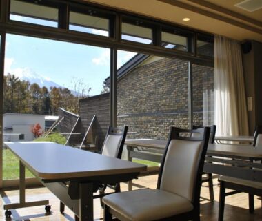 Sunlit dining area with tables and large windows at The Gran Resort Princess Fujikawaguchiko, Yamanashi, Chūbu, Japan