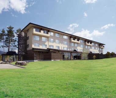 Low-rise resort building with expansive lawn at The Gran Resort Princess Fujikawaguchiko, Yamanashi, Chūbu