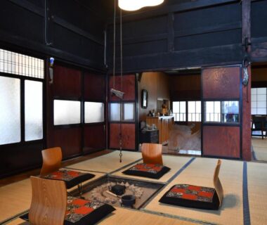 Traditional tatami room with irori hearth and zaisu chairs at Togiso in Ishikawa, Chūbu, Japan