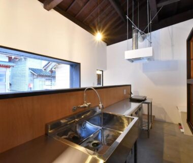 Stainless sink and counter with shoji door and vaulted wooden ceiling at Togiso 能登の古民家宿, Ishikawa, Chūbu, Japan