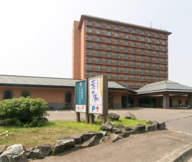 Multi-story hotel with balconies and covered entrance at Tokachi Makubetsu Onsen Grandvrio Hotel, Hokkaidō