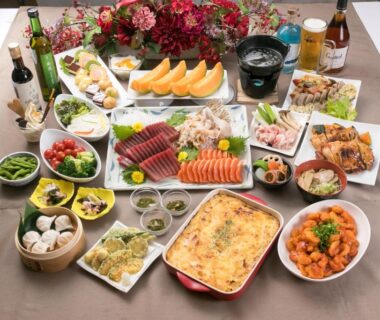 Assorted Japanese dishes including sashimi, melon, edamame, grilled plates and baked casserole at Tokachi Makubetsu Onsen in Hokkaidō