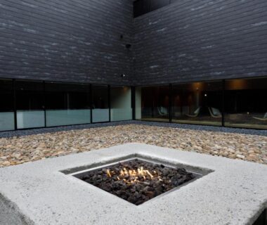 Square concrete fire pit in modern courtyard at Tokachigawa Moor Onsen Seijyakubow, Hokkaido