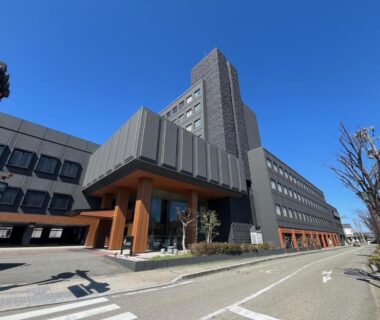 Exterior of Tokigasane ryokan with multi-story facade and street entrance in Ishikawa, Chūbu Japan