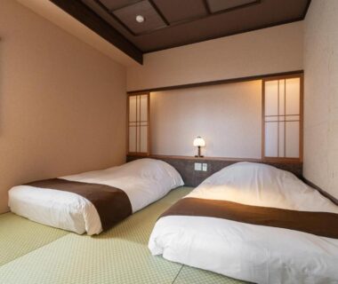 Traditional tatami room with two futon-style beds and shoji screens at Tokinoniwa in Gunma Kantō