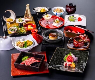 Assorted traditional small dishes arranged in lacquerware for a multi-course meal at Tokiwa Hotel in Yamanashi