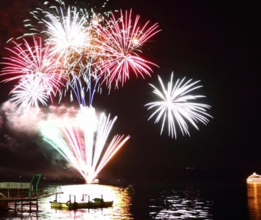 Fireworks over lake with boats near Toya Kohan Tei in Hokkaido