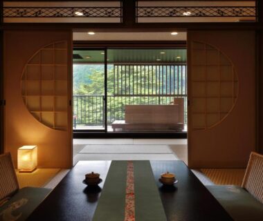Traditional tatami room with low dining table, shoji screens and garden view at Tsuganoki in Tochigi, Kantō