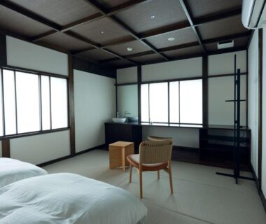 Twin futon beds on tatami with shoji screens at Tsuki to Maguro Ishigami in Shizuoka, Chūbu, Japan