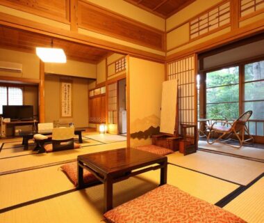 Tatami room with low table, shoji screens, garden-facing sliding doors, Tsuruya Ryokan, Nagano