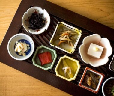Tray of assorted small Japanese side dishes at Tsutaya Tokinoyado Kazari ryokan in Nagano
