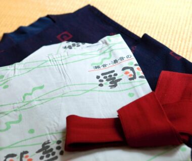 Folded yukata and red obi on tatami at Ukiha ryokan in Ōita, Kyūshū, Japan