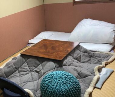 Kotatsu and futon on tatami floor at Umeoka Ryokan in Nagano, Chūbu, Japan
