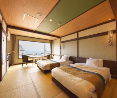 Tatami room with twin beds and sea view at Umiusagi in Shizuoka