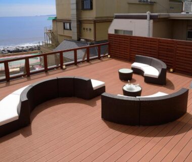 Curved outdoor seating on wooden terrace overlooking sea at Umiusagi, Shizuoka, Chūbu