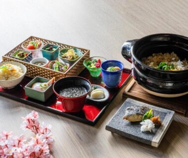 Bento tray with assorted small dishes and rice pot at Urakusatsu TOU, Gunma