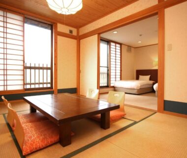 Tatami seating with low table and bed alcove at Usuki Yunosato in Ōita, Kyūshū