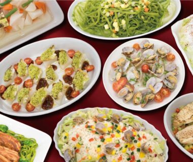 Variety of plated dishes and salads served at Villa Inawashiro ryokan in Fukushima Tōhoku