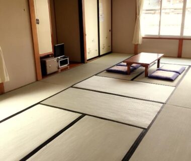 Spacious tatami room at Village Sun Lake Kawaguchiko with low table and shoji screens, Yamanashi