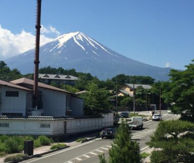 Snow-capped Mount Fuji above town near Village Sun Lake Kawaguchiko Yamanashi