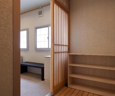 Entry genkan with wooden slatted floor and shoji door at Wakamatsu Honten, Chiba, Japan