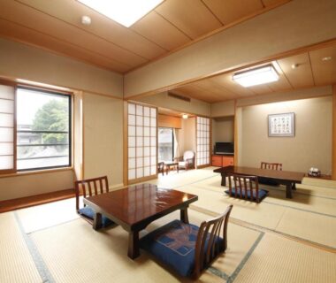 Bright tatami room with low tables, floor cushions and shoji screens, garden view, Wakamatsu Honten Chiba