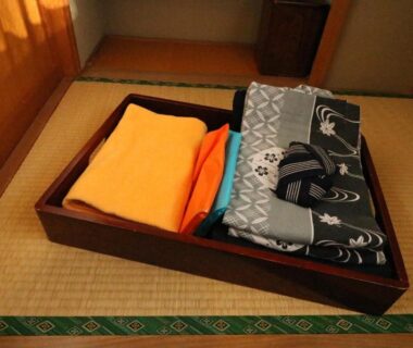 Folded yukata and towels on tatami mat at Wakamizusou ryokan, Yamanashi