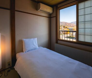 Single bed on tatami with shoji screen and mountain view, Wakata Lodge Hakuba, Nagano