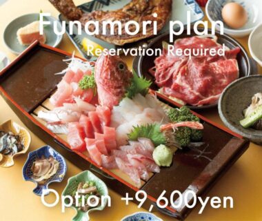 Wooden tray of assorted sashimi and raw beef with small side dishes at Wakatake Wakayama