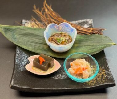 Three small ceramic dishes on a leaf-lined plate at Wakatake ryokan, Chūbu Niigata