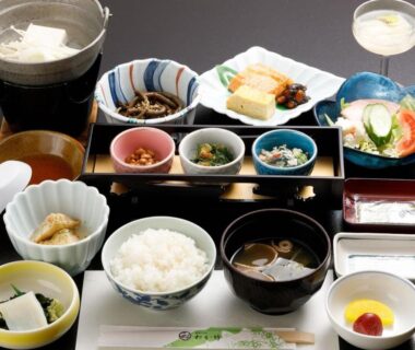 Traditional Japanese breakfast with rice, miso soup and assorted small dishes served at Wakatake ryokan in Niigata