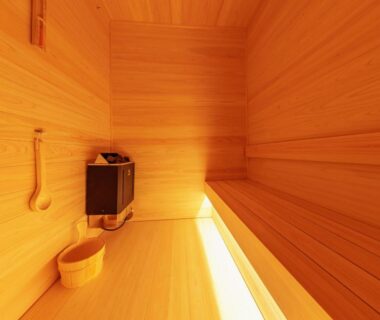 Interior wooden sauna with bench and ladle at Wan Wan Paradise Premier Nanki Shirahama, Wakayama