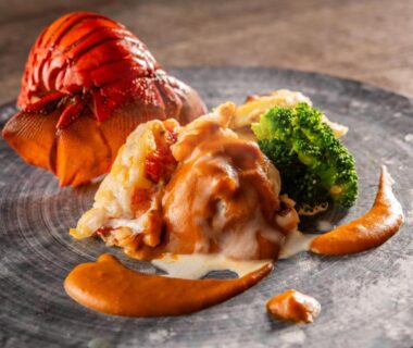 Plated lobster tail with creamy sauce and broccoli, served at Wan Wan Paradise Premier Shiobara in Tochigi, Kantō, Japan