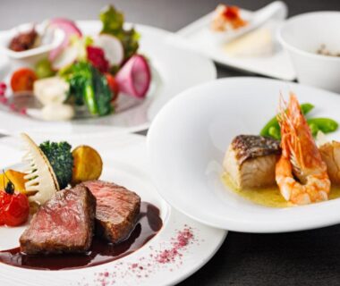Plated courses featuring seared meat, prawn and vegetables at Wan Wan Paradise Yatsugatake Yamanashi
