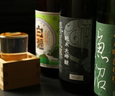 Sake bottles with wooden masu cup at Warabiso in Niigata