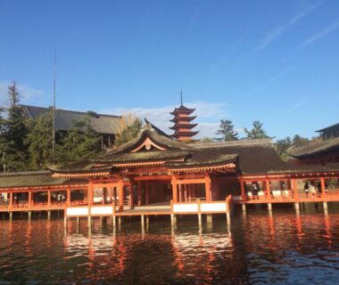 Itsukushima Shrine and pagoda over water, Wholeearth Ryokan Hiroshima, Chūgoku
