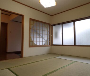 Traditional tatami room with shoji screen and large windows at Wholeearth Ryokan Hiroshima