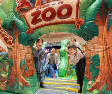 Children and adults in colorful indoor zoo play area at YATSUGATAKE KOGEN RESORT Yamanashi