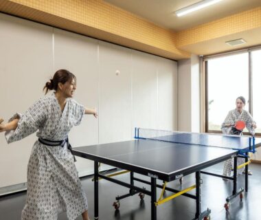 Two guests in yukata playing table tennis at YU-FURI Nasu-Takao Onsen Lodge, Tochigi recreation room
