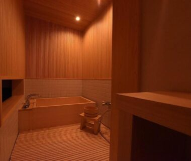 Wooden bathing room with stool and soaking tub at Yado Kiramachi, Kyoto