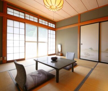 Tatami room with low table and shoji screens at Yama no Yado Meiji Onsen in Nagano