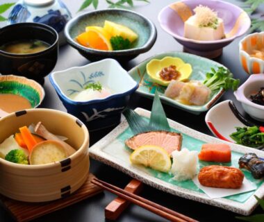 Assorted small Japanese dishes with grilled fish, pickles, miso soup at Yamabiko Ryokan, Kumamoto, Kyūshū