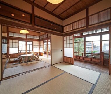 Spacious tatami room with low table and shoji screens at Yamada Bessou, Ōita, Kyūshū, Japan