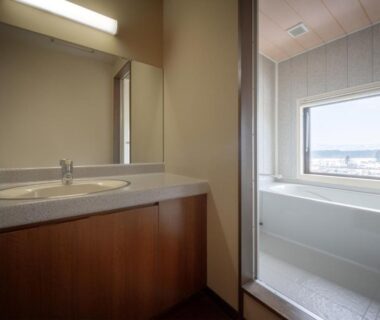 Bathroom with deep bathtub and vanity sink at Yamagataya, Fukushima, Tōhoku