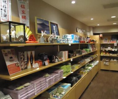Shelves of souvenirs and local products inside Yamagisi Ryokan gift shop in Yamanashi