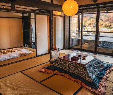 Traditional tatami room with futon and low table at Yamakikan overlooking Gunma mountains